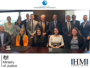 Ministry of Justice representatives and Harper Meyer members in a group photo.